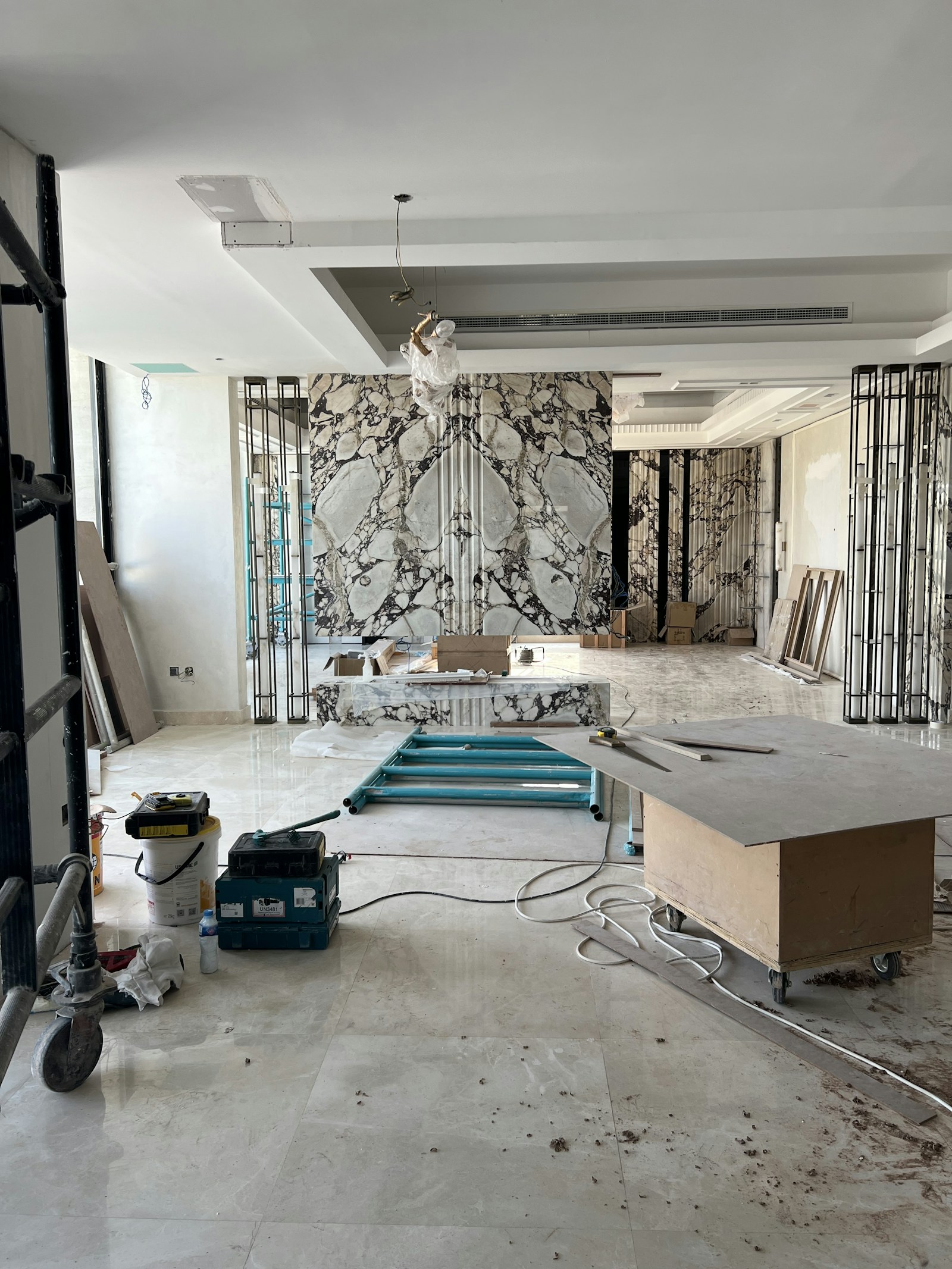 Interior renovation with a marble feature wall and large windows